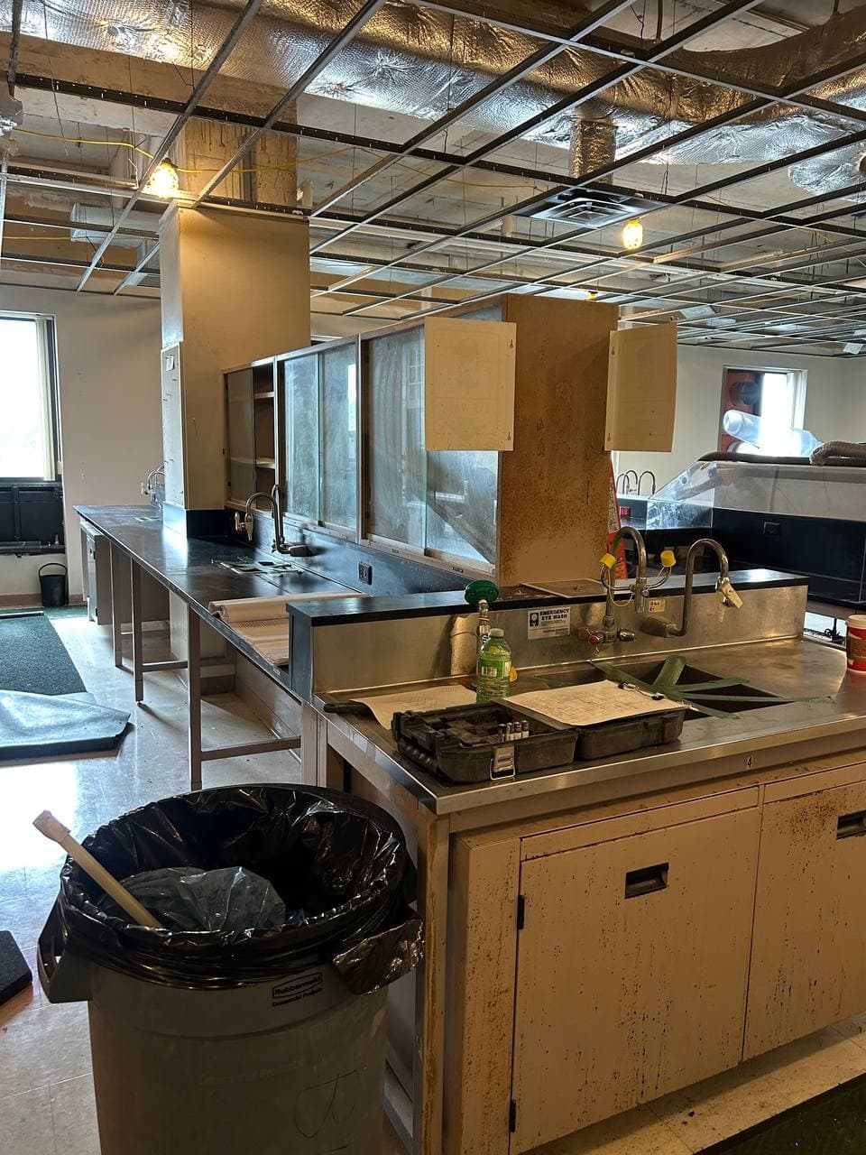 Technical interior with ceiling systems exposed during selective removal work