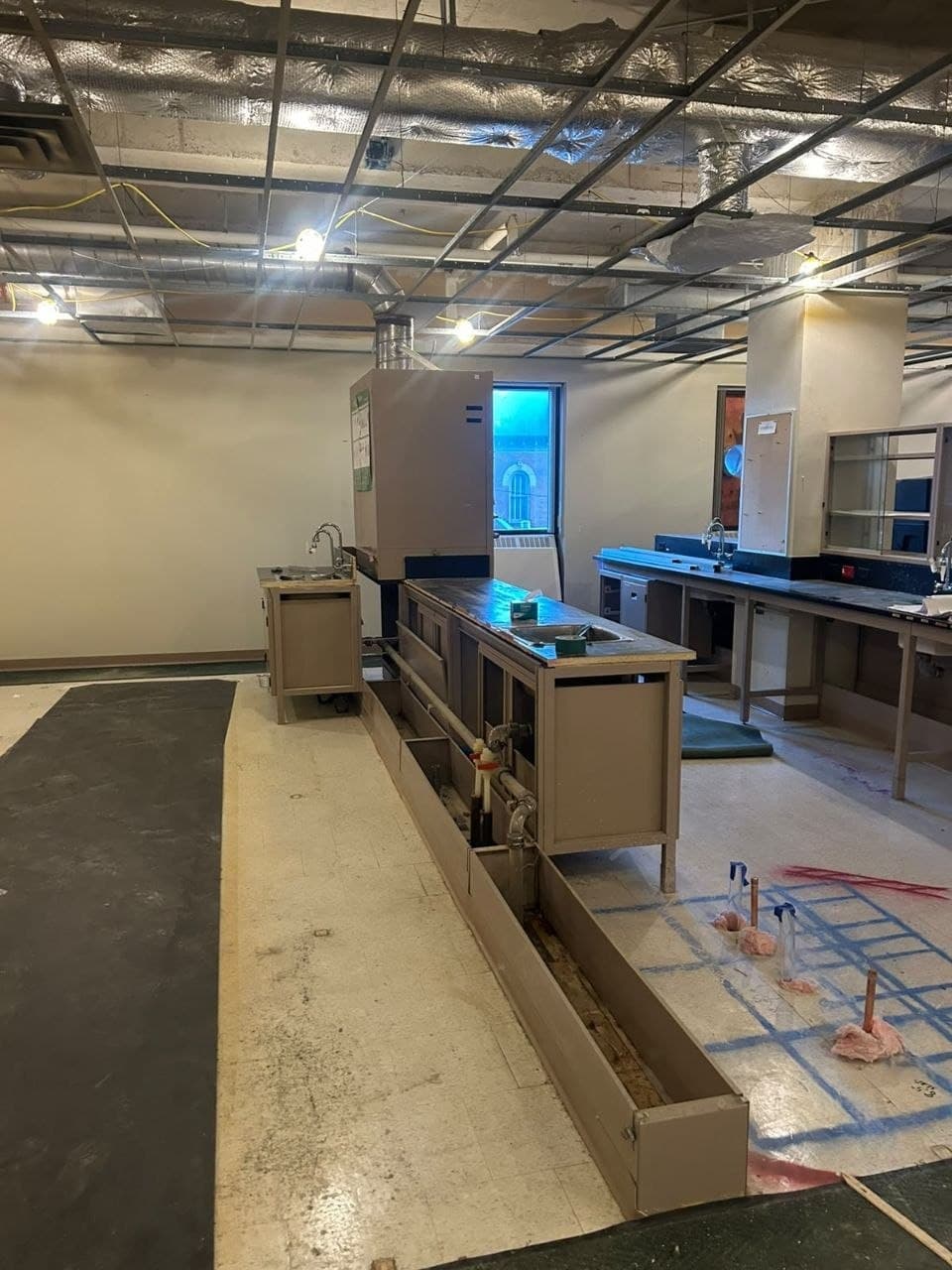 Technical interior with exposed ceiling grid and building services