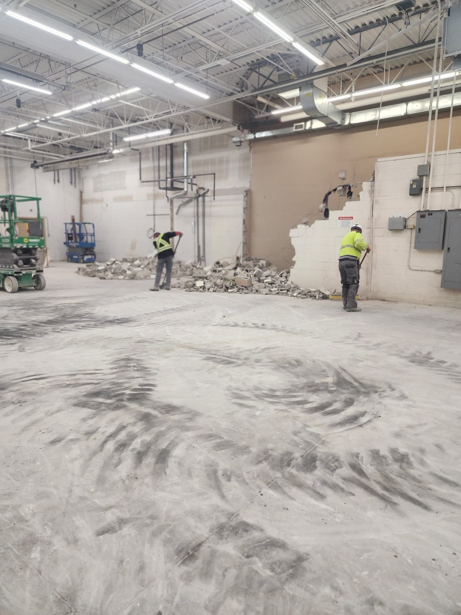 Wide Walmart Sarnia demolition area with crew and cleared floor